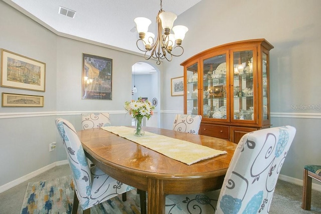 4219 Lillian Hall Ln, Orlando, FL 32812 - dining room with arched walkways, an inviting chandelier, carpet, and visible vents