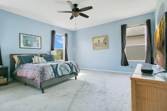 4219 Lillian Hall Ln, Orlando, FL 32812 - carpeted bedroom with baseboards, multiple windows, and ceiling fan