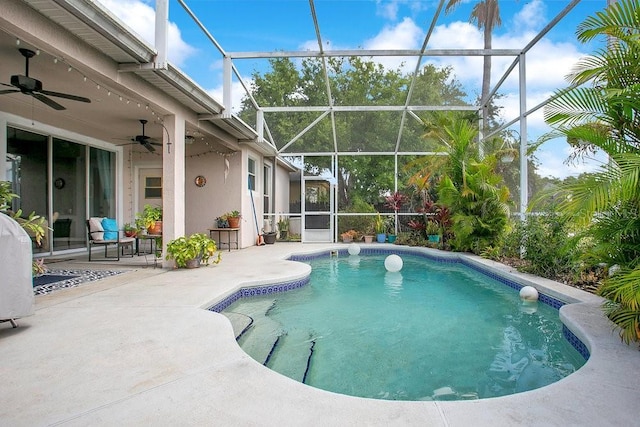 4219 Lillian Hall Ln, Orlando, FL 32812 - outdoor pool featuring glass enclosure, ceiling fan, and a patio area