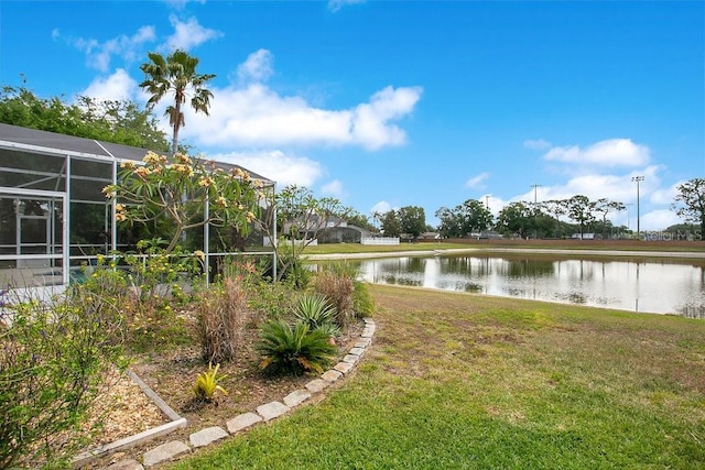 4219 Lillian Hall Ln, Orlando, FL 32812 - view of yard featuring glass enclosure and a water view
