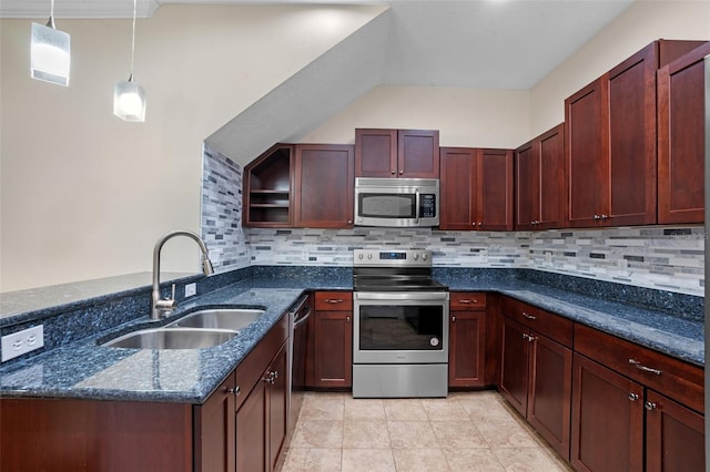8031 Enchantment Dr Unit Ge, Windermere, FL 34786 - kitchen featuring a sink, a peninsula, backsplash, dark stone counters, and appliances with stainless steel finishes