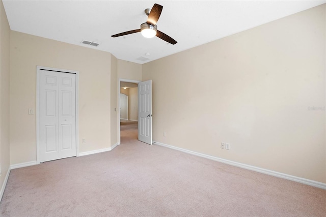 8031 Enchantment Dr Unit Ge, Windermere, FL 34786 - unfurnished bedroom with light colored carpet, a closet, visible vents, and baseboards