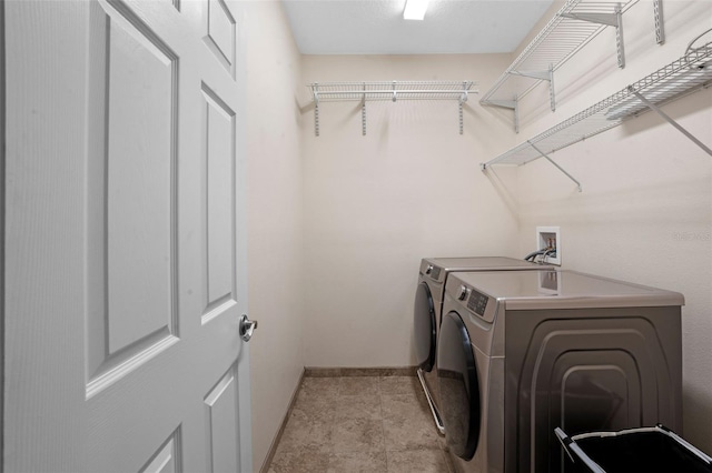 8031 Enchantment Dr Unit Ge, Windermere, FL 34786 - clothes washing area featuring laundry area, baseboards, and separate washer and dryer