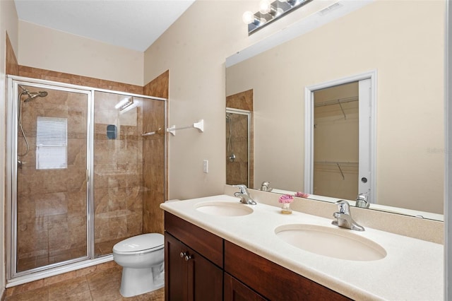 8031 Enchantment Dr Unit Ge, Windermere, FL 34786 - bathroom with a stall shower, toilet, a sink, and double vanity