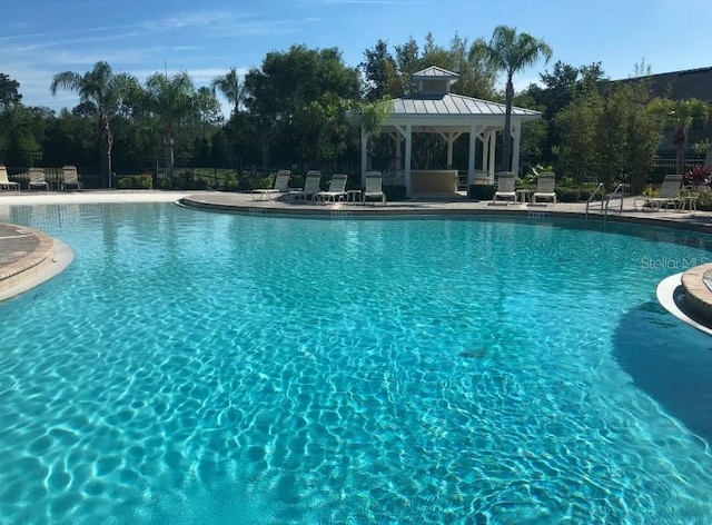 8031 Enchantment Dr Unit Ge, Windermere, FL 34786 - pool with a gazebo and a patio