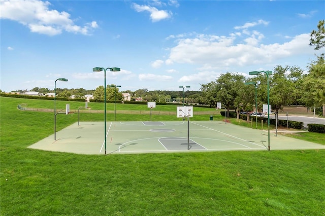 view of basketball court featuring community basketball court and a yard