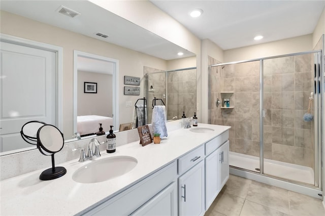 5347 Travertine St, Mount Dora, FL 32757 - bathroom with a stall shower, ensuite bathroom, tile patterned flooring, double vanity, and recessed lighting
