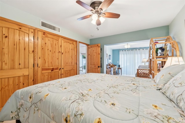 bedroom with visible vents and a ceiling fan