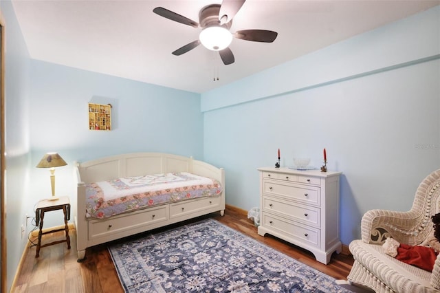 bedroom featuring ceiling fan and wood finished floors