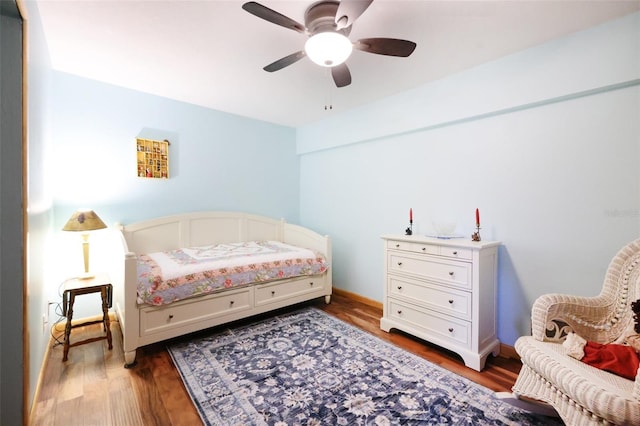 bedroom featuring a ceiling fan and wood finished floors