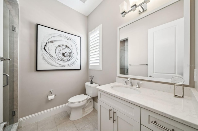 bathroom with baseboards, a stall shower, toilet, and vanity