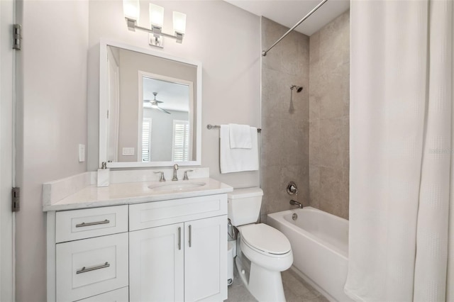 bathroom featuring toilet, ceiling fan, shower / bath combination with curtain, and vanity