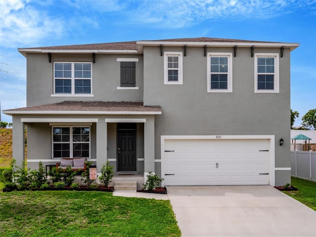 3033 Beau Loop, Tavares, FL 32778 - traditional-style home featuring stucco siding and a front lawn