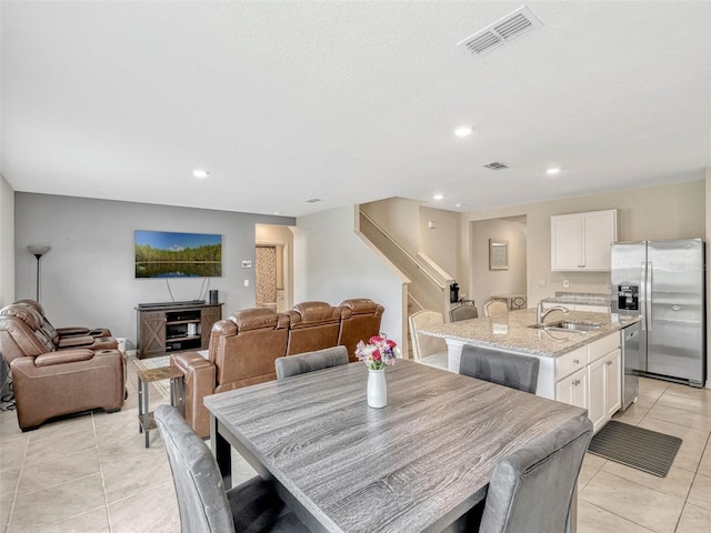 3033 Beau Loop, Tavares, FL 32778 - dining room with stairs, recessed lighting, visible vents, and light tile patterned floors