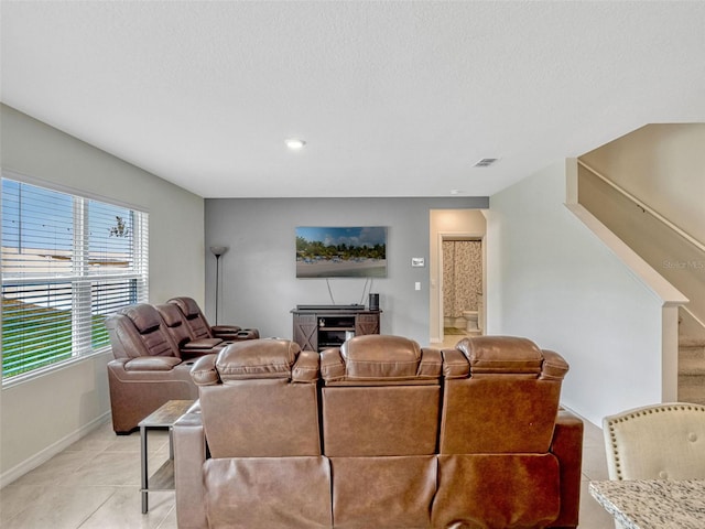 3033 Beau Loop, Tavares, FL 32778 - living area featuring visible vents, baseboards, and light tile patterned floors