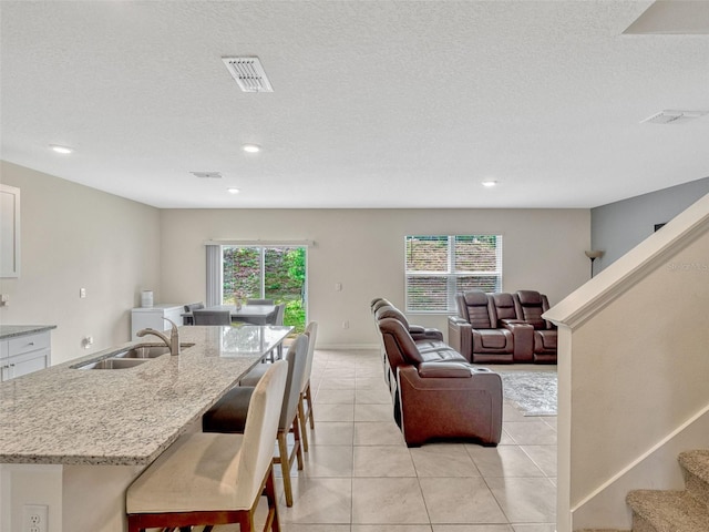 3033 Beau Loop, Tavares, FL 32778 - dining space featuring stairs, recessed lighting, visible vents, and light tile patterned floors