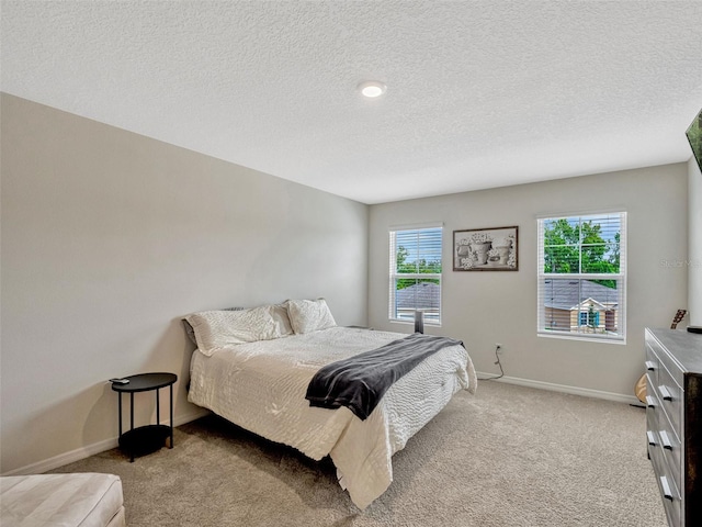 3033 Beau Loop, Tavares, FL 32778 - carpeted bedroom with a textured ceiling and baseboards