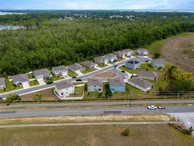 3033 Beau Loop, Tavares, FL 32778 - drone / aerial view featuring a residential view and a wooded view