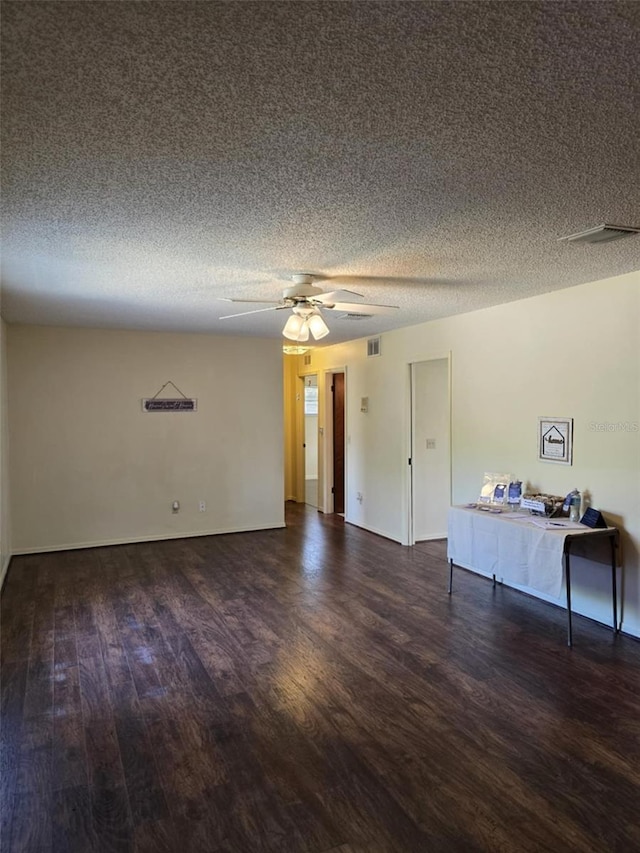 unfurnished living room featuring visible vents, a ceiling fan, a textured ceiling, and wood finished floors