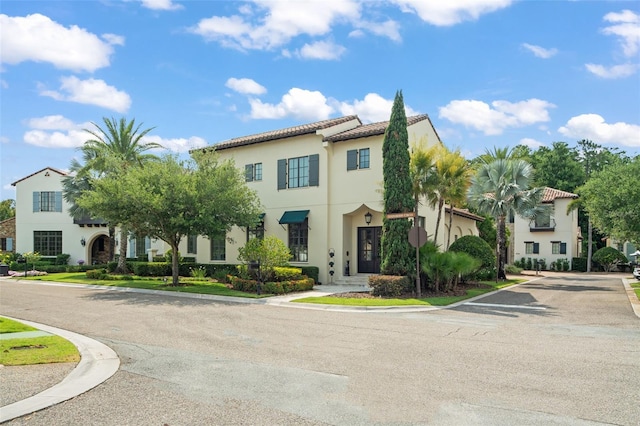 9730 Lounsberry Cir, Golden Oak, FL 32836 - view of front of home featuring stucco siding and a tile roof