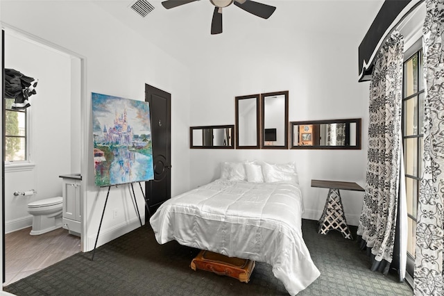9730 Lounsberry Cir, Golden Oak, FL 32836 - bedroom featuring ensuite bath, baseboards, and ceiling fan