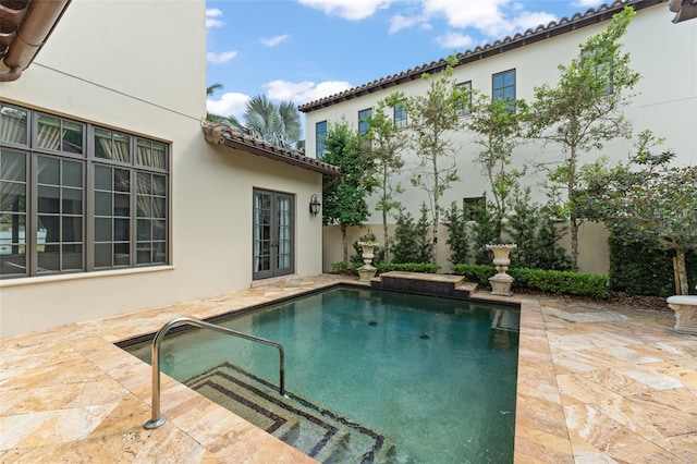 9730 Lounsberry Cir, Golden Oak, FL 32836 - swimming pool with a patio and french doors