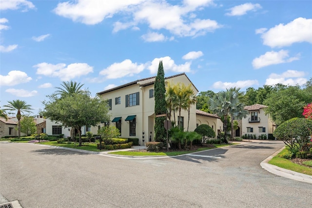9730 Lounsberry Cir, Golden Oak, FL 32836 - view of front of home with a residential view and stucco siding