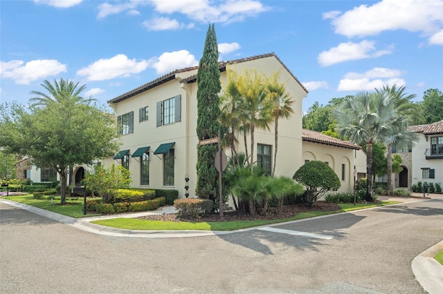 9730 Lounsberry Cir, Golden Oak, FL 32836 - view of home's exterior featuring stucco siding and a tiled roof