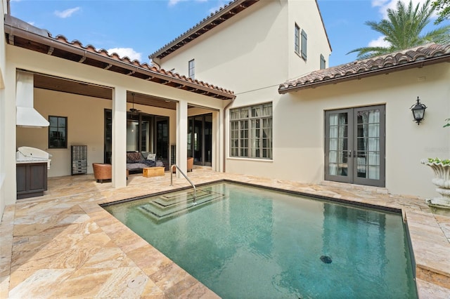 9730 Lounsberry Cir, Golden Oak, FL 32836 - swimming pool with french doors and a patio