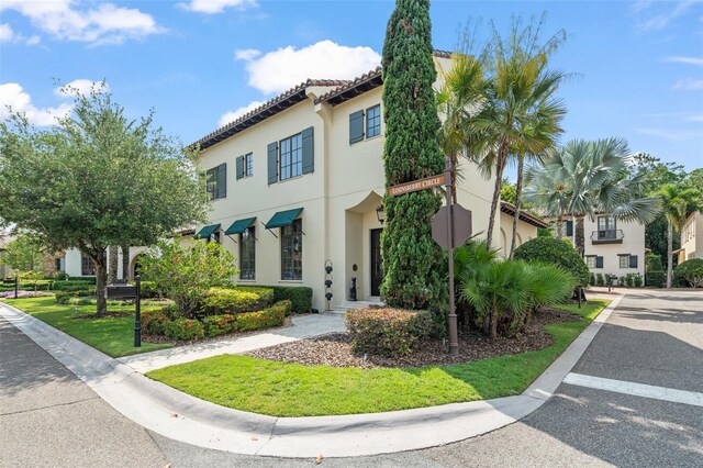 9730 Lounsberry Cir, Golden Oak, FL 32836 - view of front of home with stucco siding