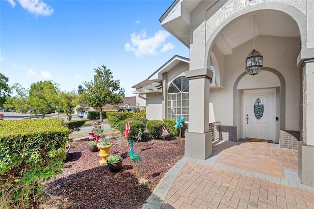 property entrance featuring stucco siding