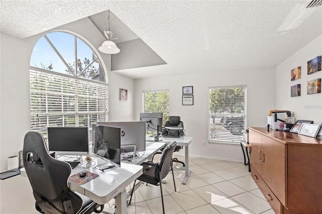 office with visible vents, baseboards, a textured ceiling, and light tile patterned floors