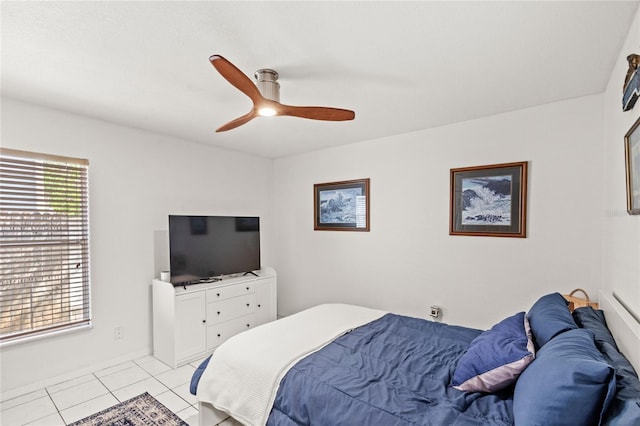 bedroom featuring a ceiling fan and light tile patterned flooring