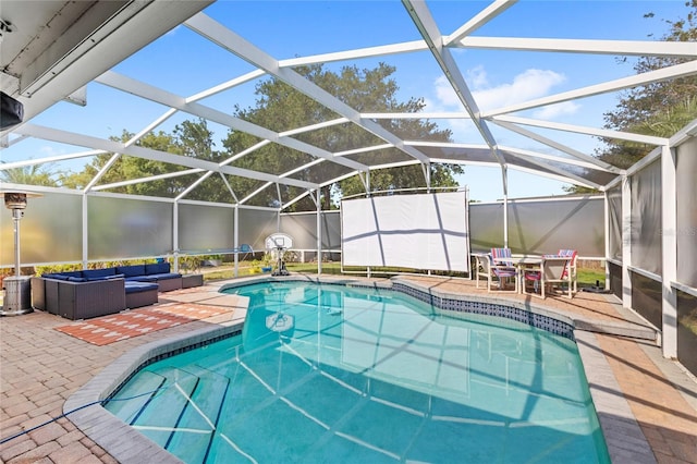 outdoor pool with outdoor lounge area, a patio, outdoor dining area, a storage unit, and glass enclosure
