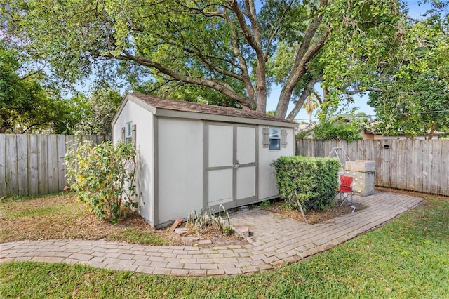 view of shed with a fenced backyard