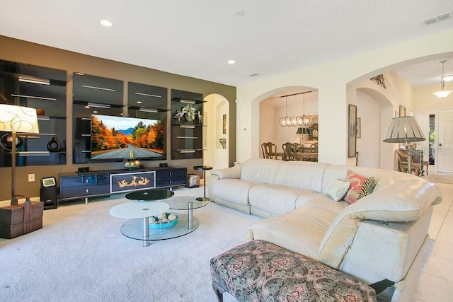 18108 Bellezza Dr, Orlando, FL 32820 - living room featuring visible vents, arched walkways, carpet, and recessed lighting