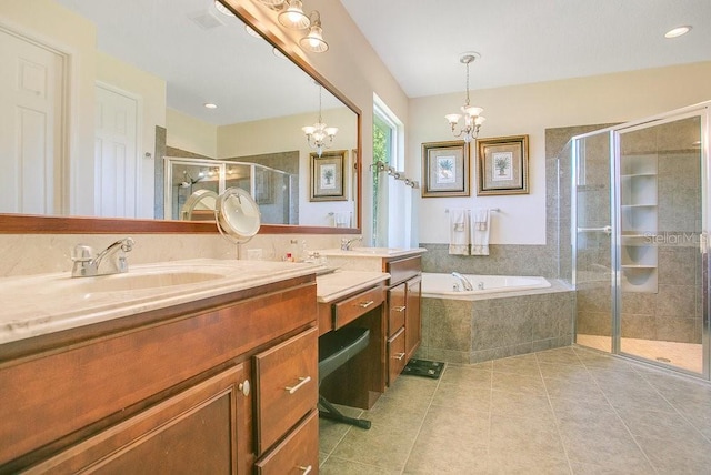 18108 Bellezza Dr, Orlando, FL 32820 - full bath with a notable chandelier, a sink, tile patterned flooring, a garden tub, and a stall shower