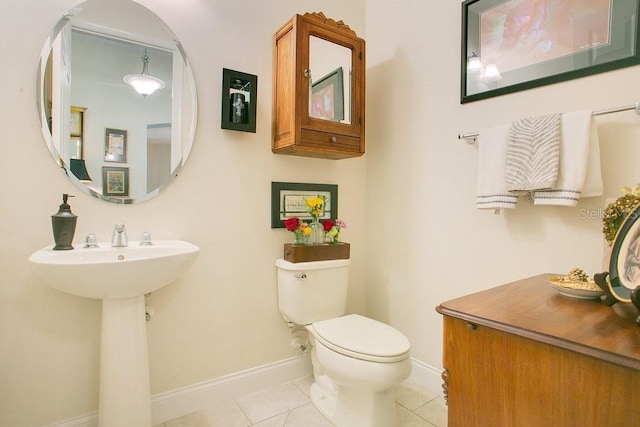 18108 Bellezza Dr, Orlando, FL 32820 - bathroom with tile patterned flooring, baseboards, and toilet