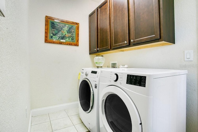 18108 Bellezza Dr, Orlando, FL 32820 - clothes washing area featuring light tile patterned floors, baseboards, independent washer and dryer, and cabinet space