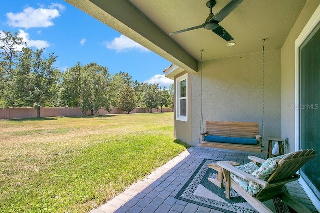 18108 Bellezza Dr, Orlando, FL 32820 - view of yard featuring fence, a ceiling fan, and a patio area
