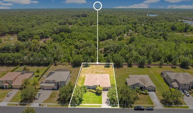 18108 Bellezza Dr, Orlando, FL 32820 - drone / aerial view with a residential view and a forest view
