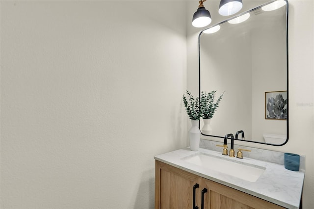 half bath featuring vanity