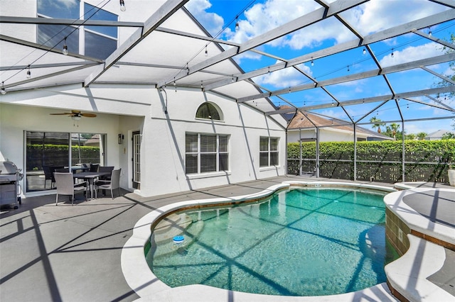 view of pool with a fenced in pool, ceiling fan, a patio area, and a lanai