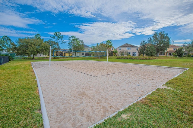 surrounding community featuring a yard, a residential view, and volleyball court