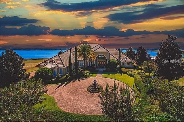 birds eye view of property with a water view