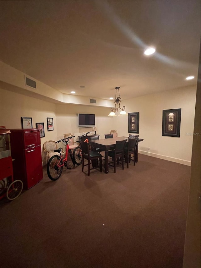 dining space with recessed lighting, baseboards, dark colored carpet, and visible vents