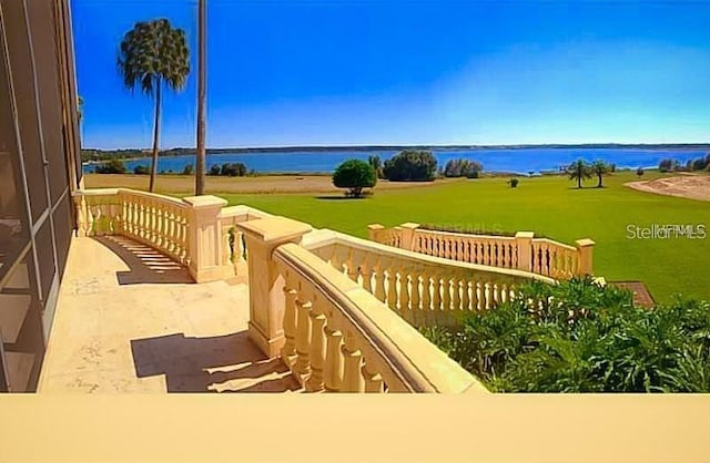 wooden deck featuring a water view