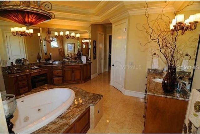 bathroom with vanity, baseboards, a whirlpool tub, a chandelier, and ornamental molding