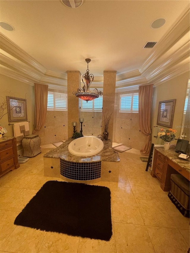 full bath with crown molding, plenty of natural light, a tray ceiling, and a jetted tub