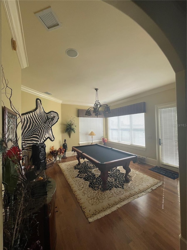 game room with visible vents, crown molding, wood finished floors, pool table, and arched walkways